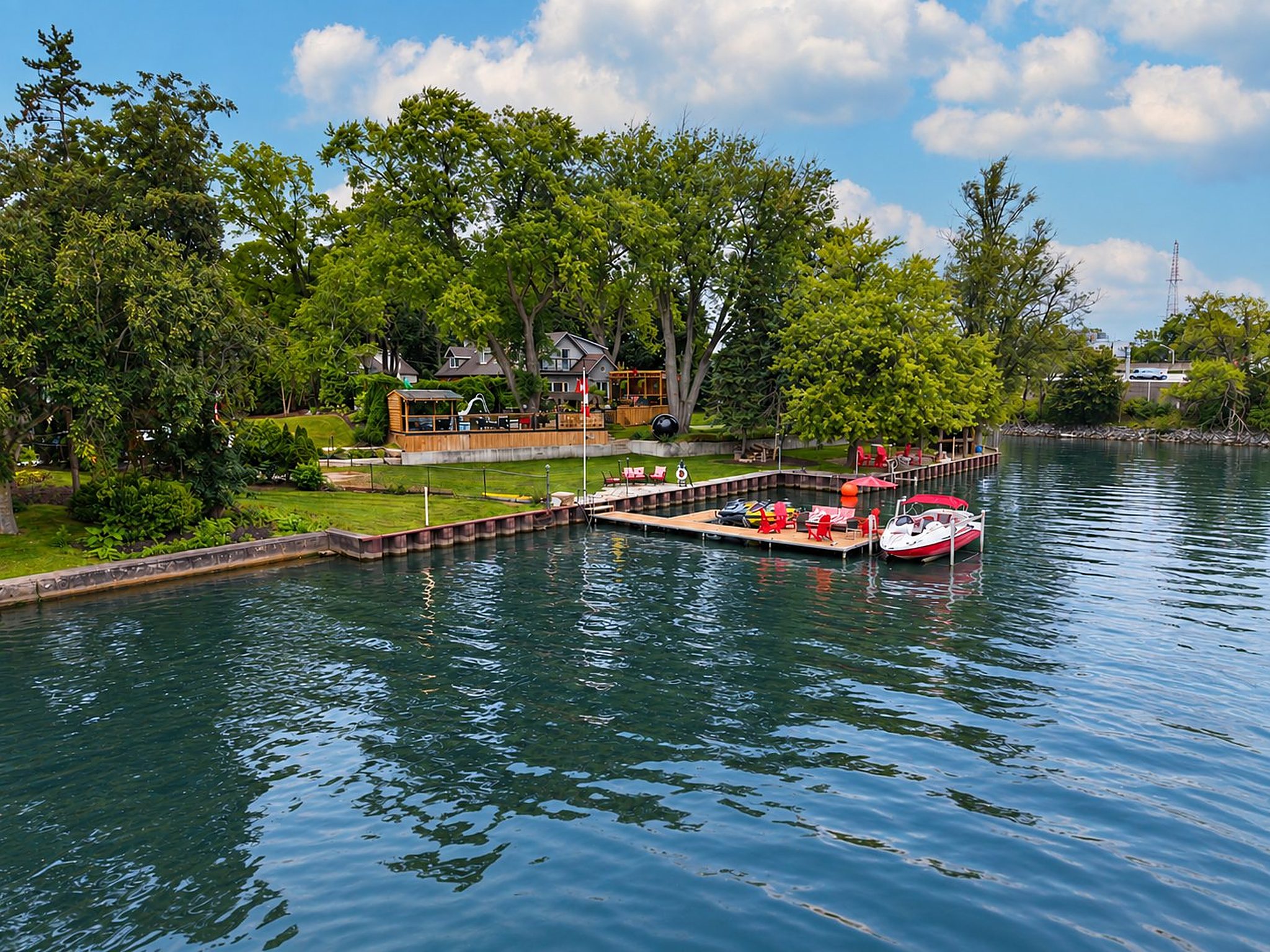 The property, the lawn and the dock from out on the bay