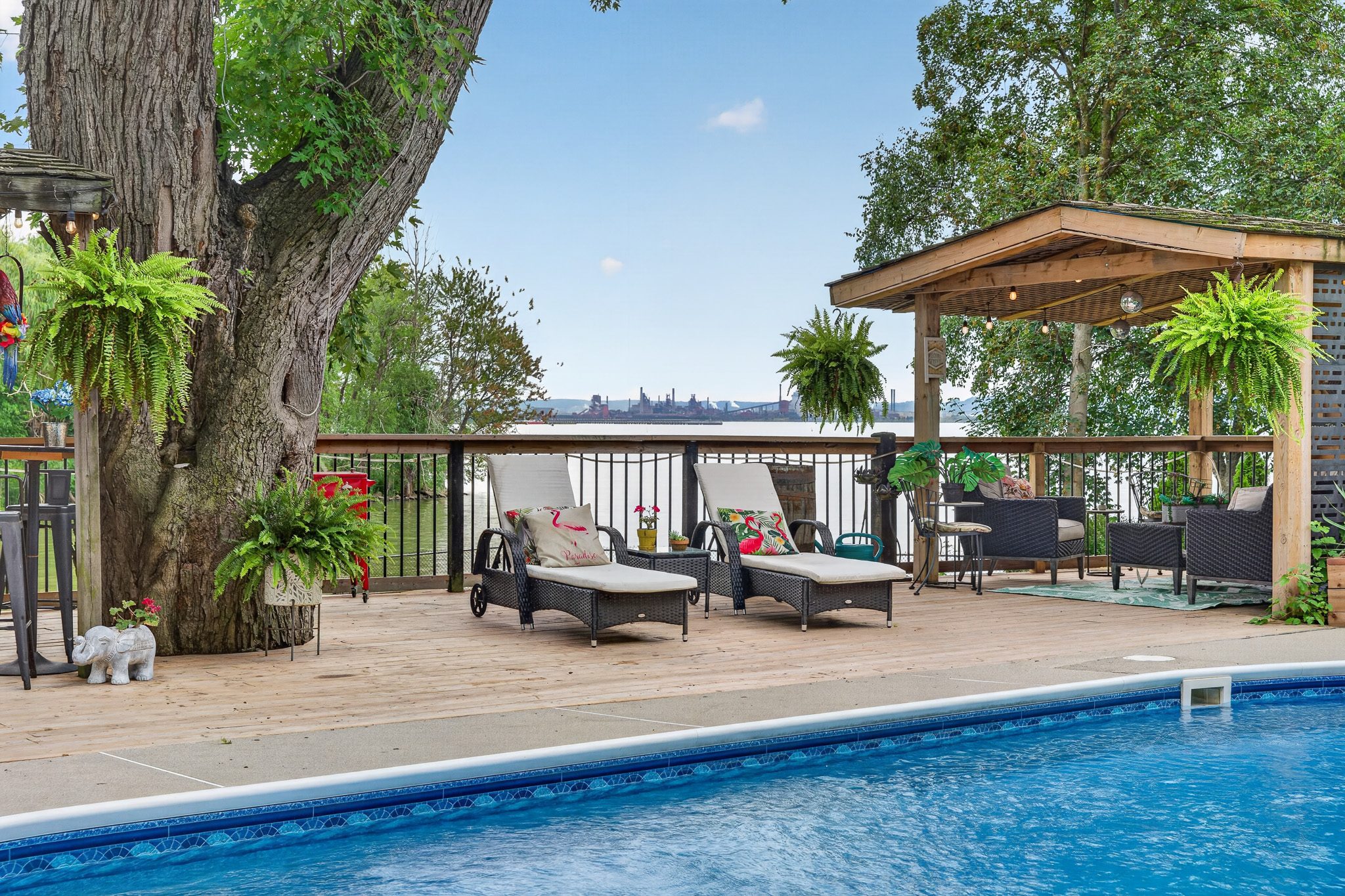 The pool with the lounge deck and the bay beyond