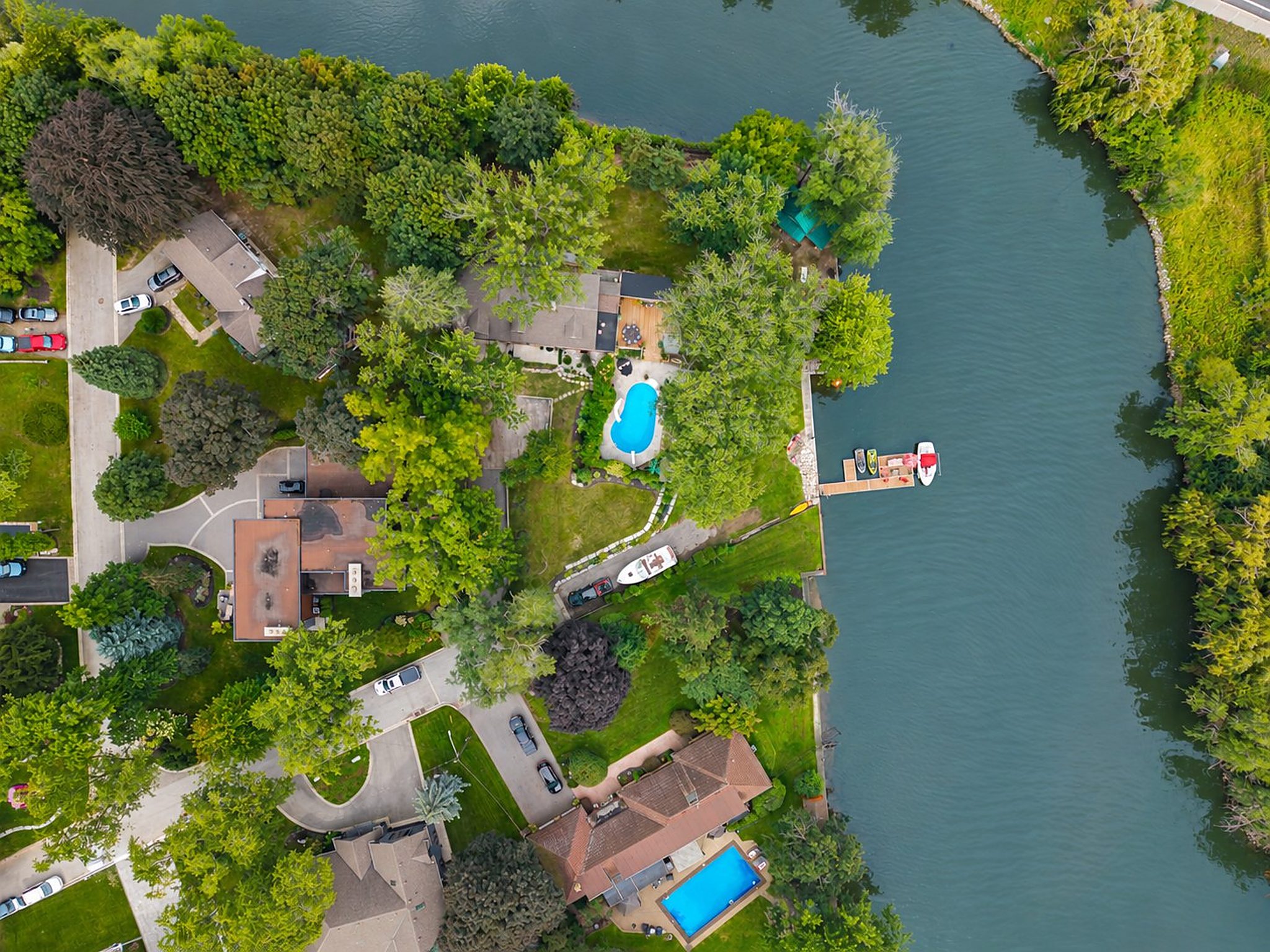 The whole property from above: the house, pool, lawn and dock on the point
