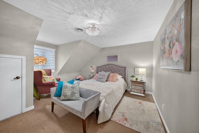 A bedroom on the upper level