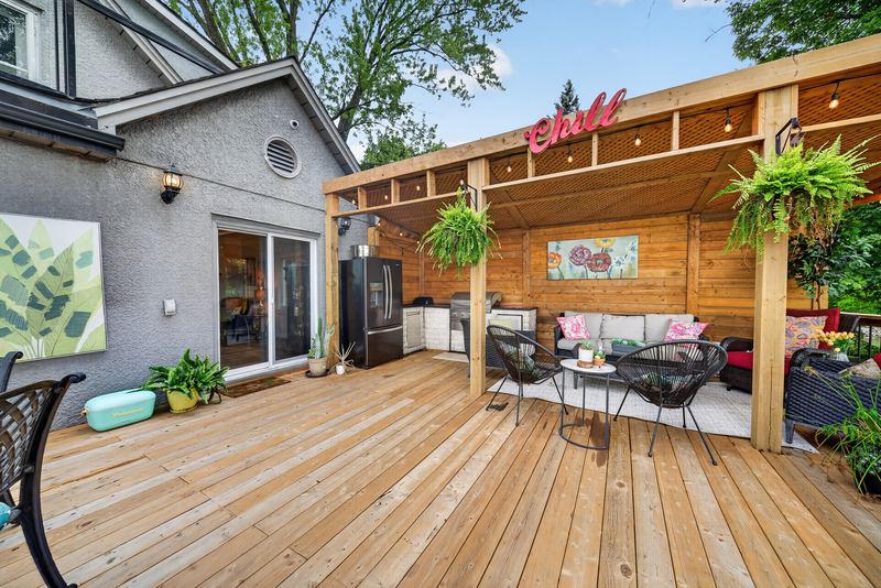 The deck and the covered bar beside the house