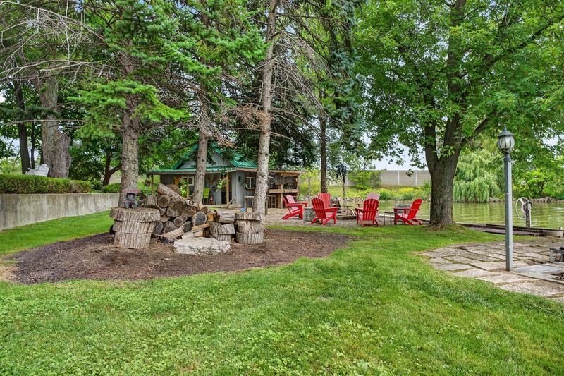 The stone fire circle and the lawn to the water