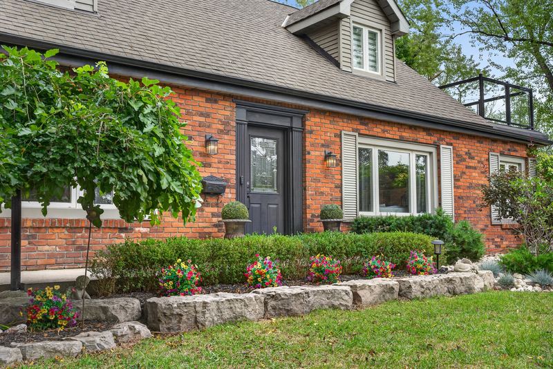 The front elevation and stone-edged gardens