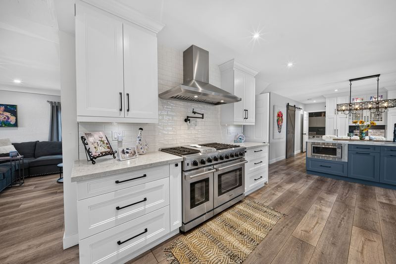 The kitchen's long run of white cabinetry